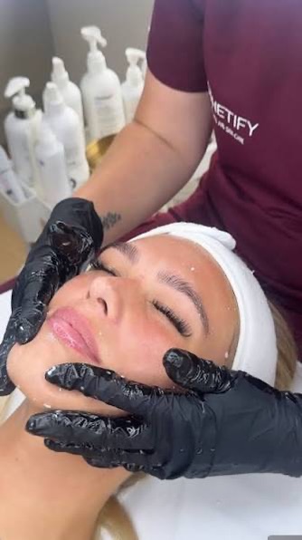A facial under way at Aesthetify, the client resting in a white headband